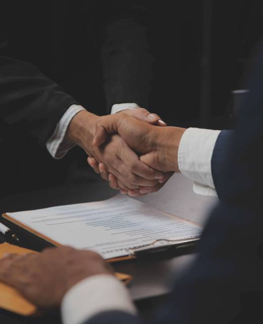 Business and lawyers discussing contract papers with brass scal Business and lawyers discussing contract papers with brass scale on desk in office. Law, legal services, advice, justice and law concept picture with film grain effect
